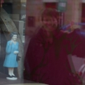 Kiri waving to the Queen in a window