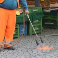 Cleaning the cobbles with a flamethrower... genius!