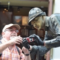 The best human statue in Munich showing a tourist how to use his camera