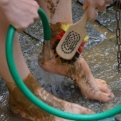 Kiri, washing her feet with a patriotic brush