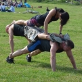 Two really strong guys under a woman