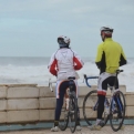 Cyclists taking in the waves