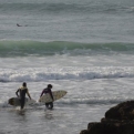 A couple take to the surf together