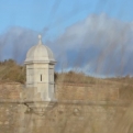 Castle turret through grass